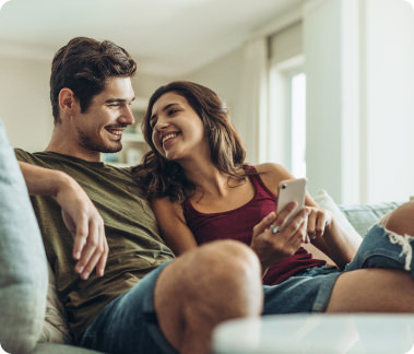 couple sitting on sofa looking at each other