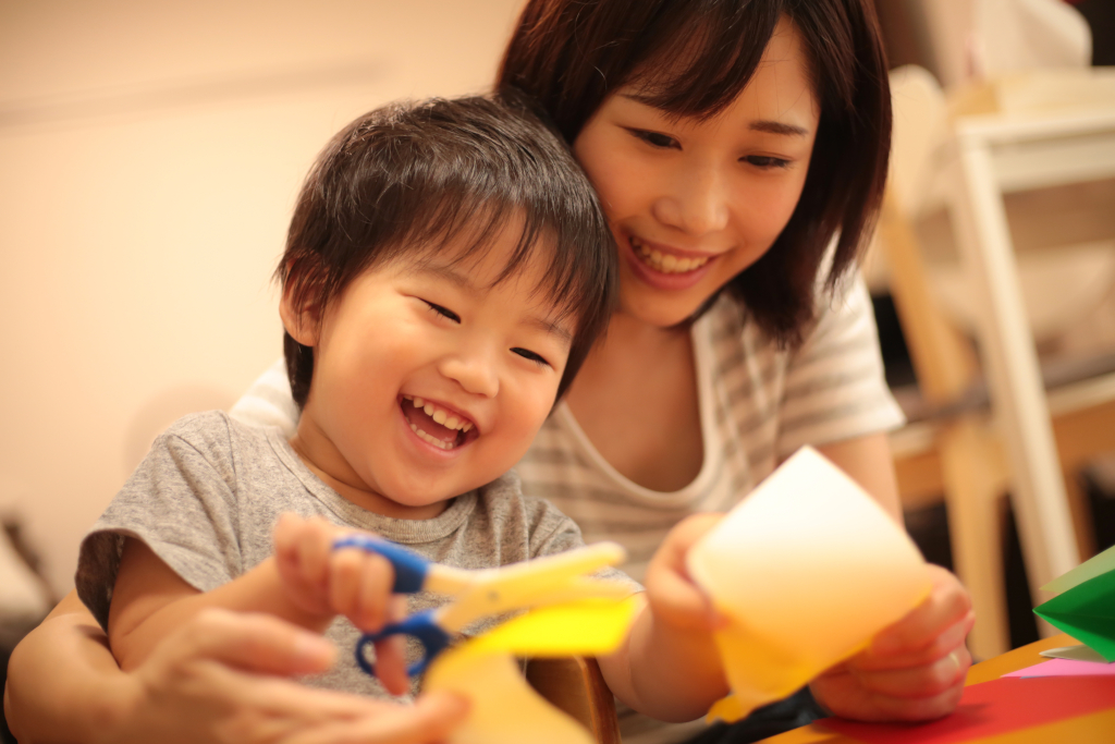 Boy Making Fun Crafts with His Mother