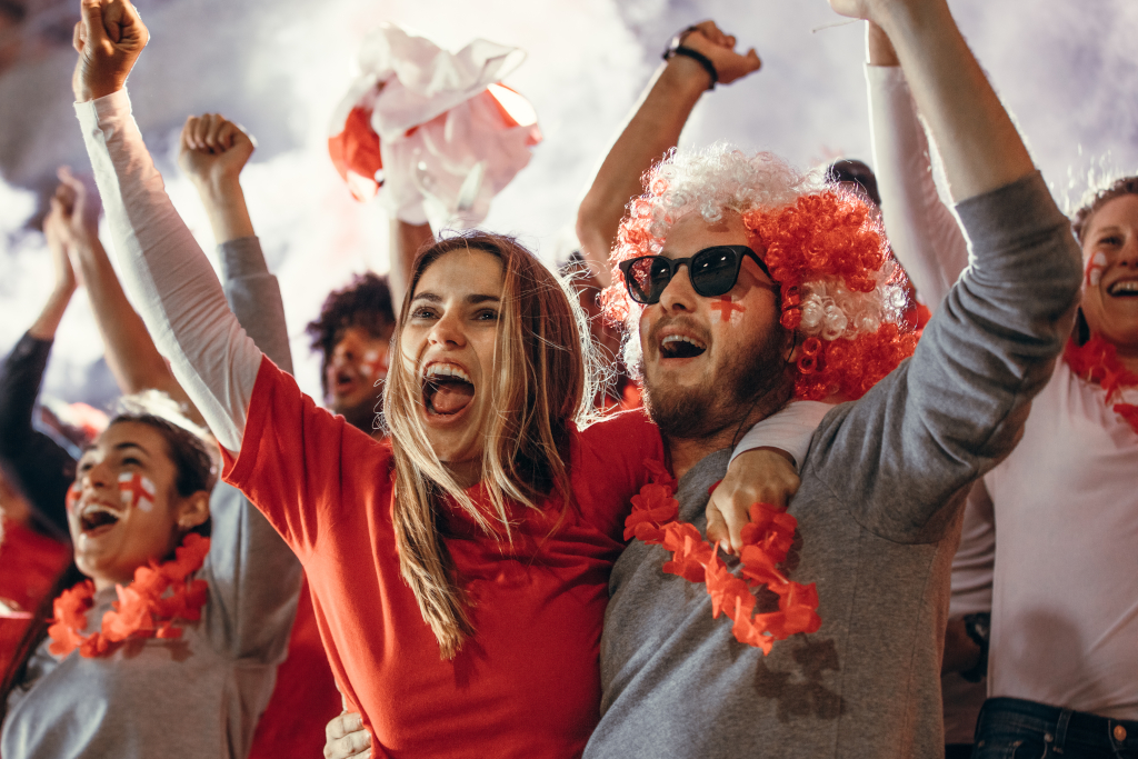 Couple Cheering on Their Team