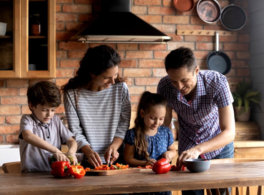 Couple Teaching Kids a Family Recipe