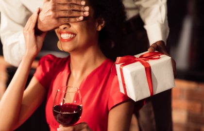 Romantic,Date.,Unrecognizable,African,American,Boyfriend,Covering,Girfriend's,Eyes,Giving